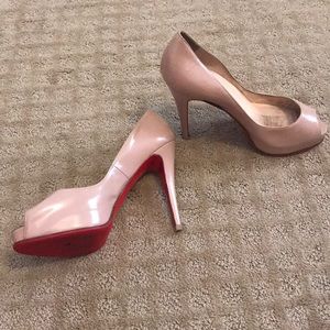 Nude patent leather Christian Louboutin heels.